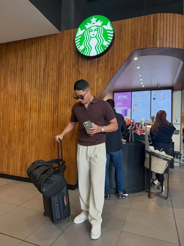 16 Airport Outfit Ideas for Men Over 40 Looks That Feel Age-Appropriate 3 Knit Polo and Wide Leg Trousers for a Put Together Terminal Look