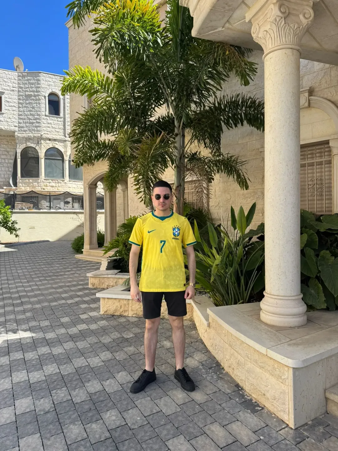 3. Yellow Brazil Jersey With Black Shorts and Sneakers