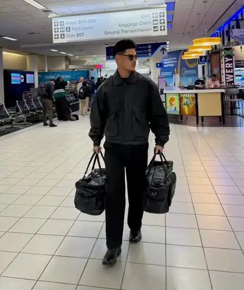 12. The Cropped Bomber Jacket and All Black Ensemble