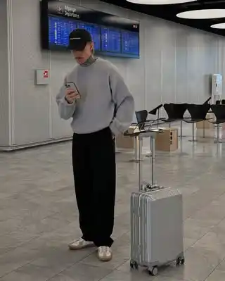 13 Airport Outfit Men Winter Combos for Cold Layovers 13 12. Grey Crewneck Sweatshirt and Wide Trousers