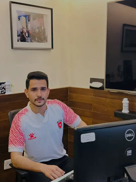 25 Soccer Jersey Outfit Men Business Casual Combos That Work 16 White and Red Kelme Jersey at a Desk