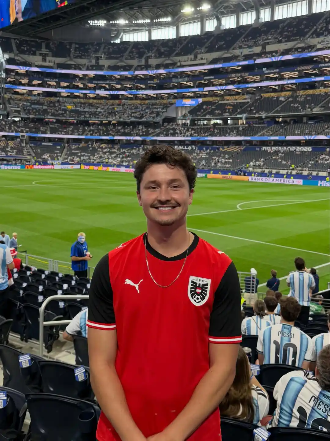 12. Red and Black Austria Jersey With Gold Chain