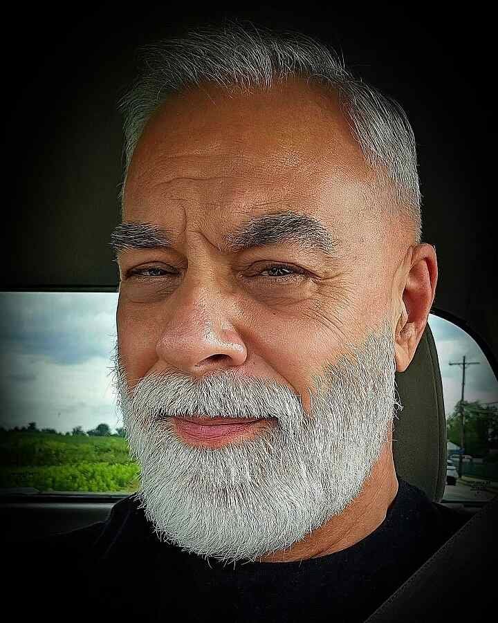 Grey Hair Styles for Men Over 50: 18 Looks That Command Respect 9 Short on the Sides, Long on the Beard: Let It Be the Focus