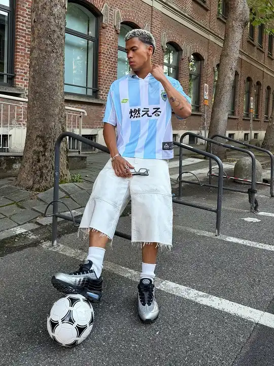 17 Soccer Jersey Streetwear Outfit Ideas for Men 6 Striped Blue Jersey with Distressed Jorts
