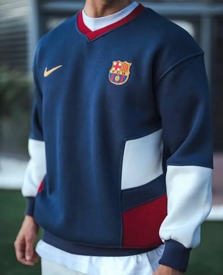 Navy Club Crewneck Layered Over a White Long Sleeve