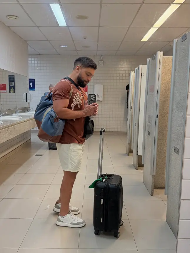 16 Airport Outfit Ideas for Men Over 40 Looks That Feel Age-Appropriate 7 Tailored Shorts and a Rust Tee for a Warm Weather Arrival