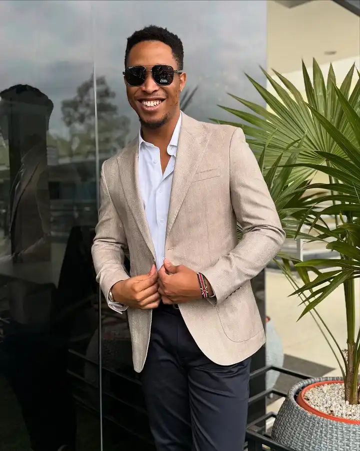 16 Stylish Airport Outfits for Men on Business Trips 4 The Tan Blazer and Open Collar Combo That Reads Business, Not Boardroom