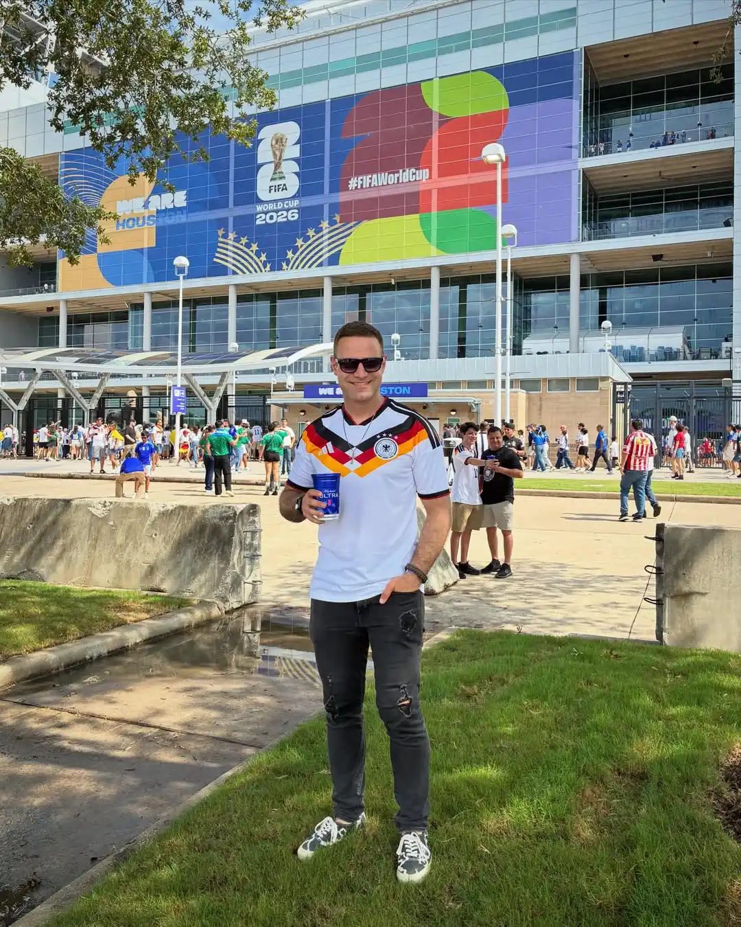 11. Soccer Jersey With Distressed Jeans and Printed Sneakers