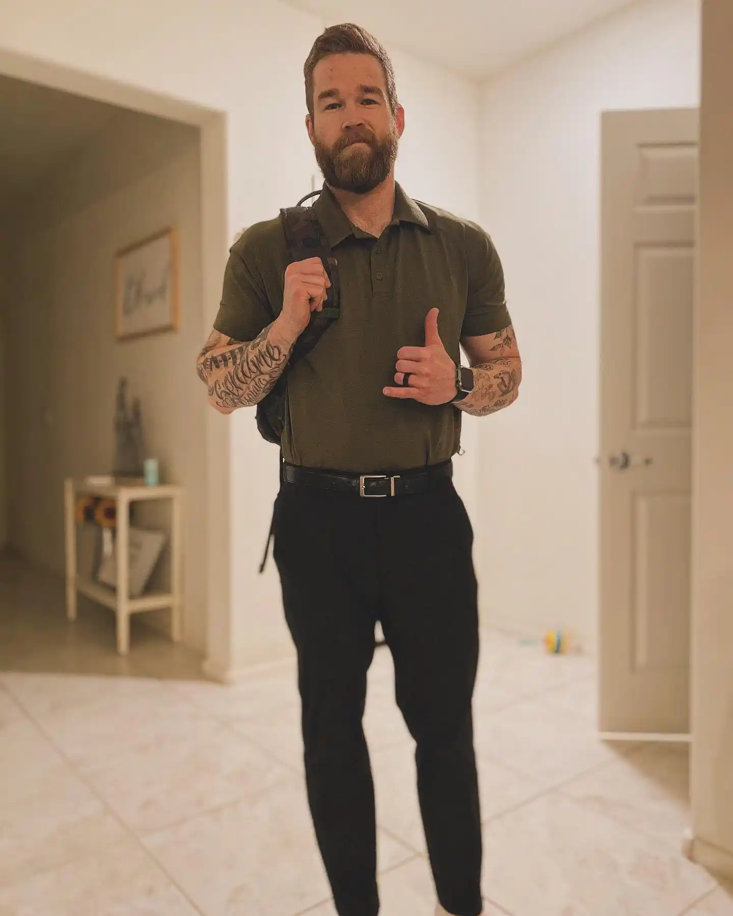 10. Olive Green Polo and Black Fitted Trousers