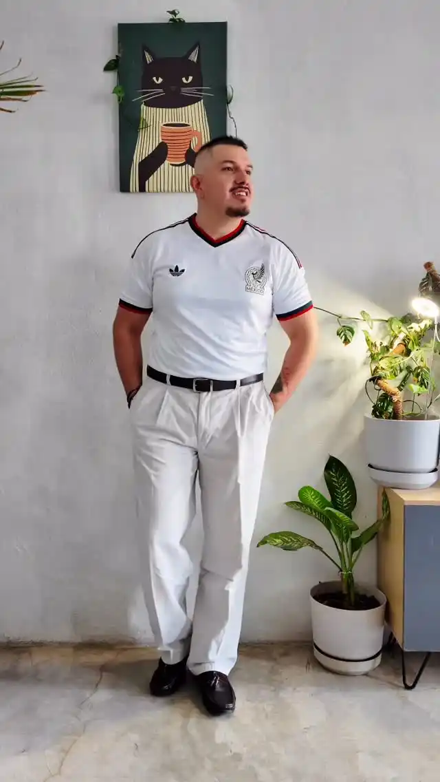 1. Tucked Into Pleated Trousers