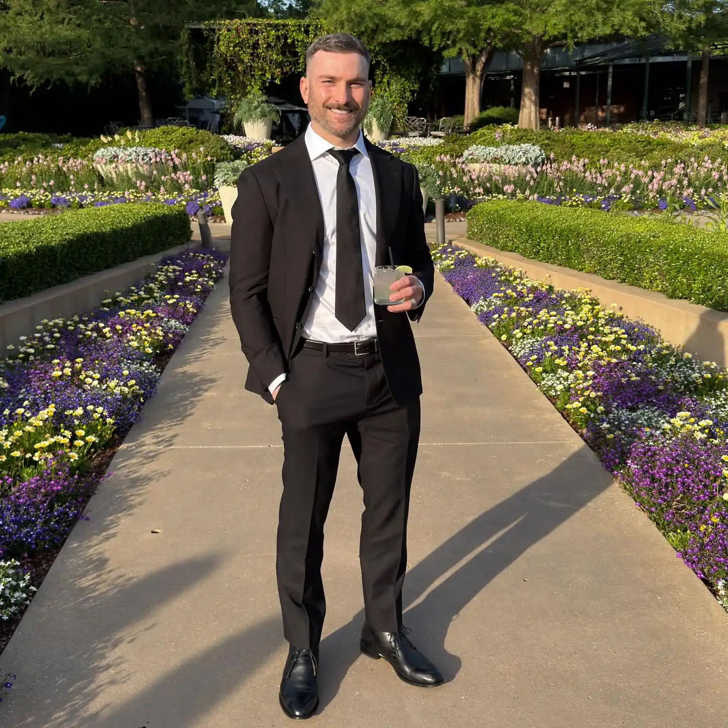 7. Classic Black Suit with Wide Silk Tie