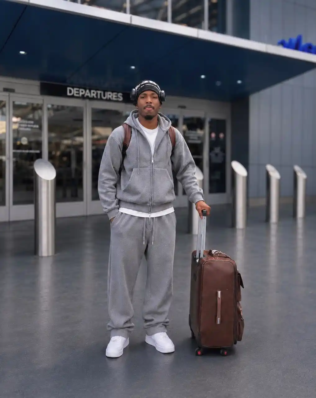12. Monochromatic Grey Sweatsuit with Leather Accents