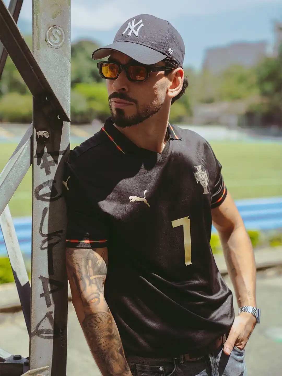 11. Black Portugal Puma Number 7 Jersey With NY Cap And Amber Sunglasses