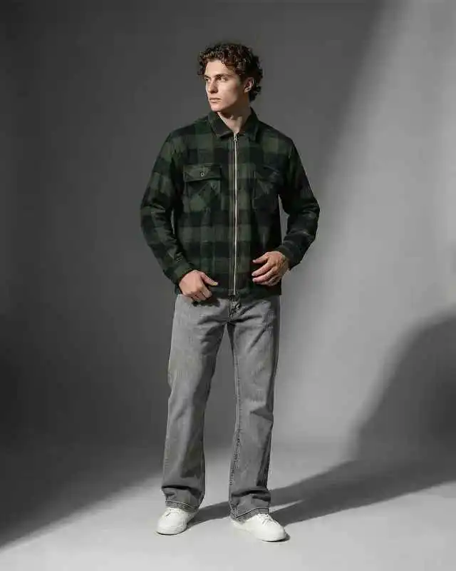 10 Men’s Country & Cabin Trip Outfit Ideas (Casual & Cozy) 6 5. Plaid Zip Jacket and Grey Jeans