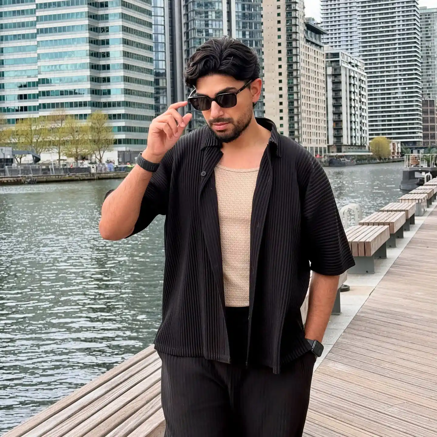17 Resort‑Ready Men’s Outfits for Tropical Vacations 10 9. Pleated Black Co-ord and Sunglasses