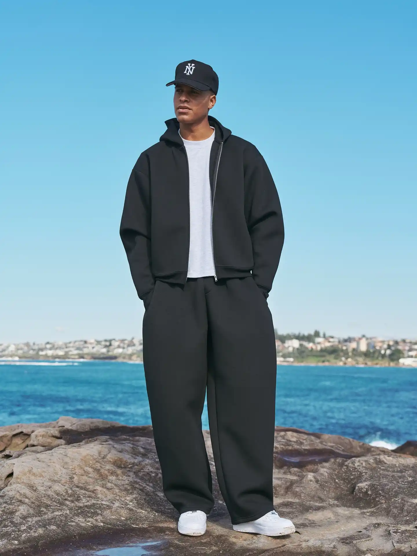 11 Minimalist Outfits for Men That Work Every Day 9 8. Oversized Tracksuit and White Tee