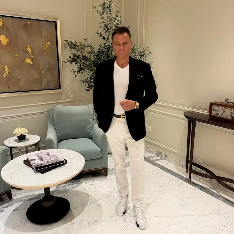 16 Stylish Airport Outfits for Men on Business Trips 11 Black Blazer Over a Simple Tee for Downtime in the Hotel Lobby