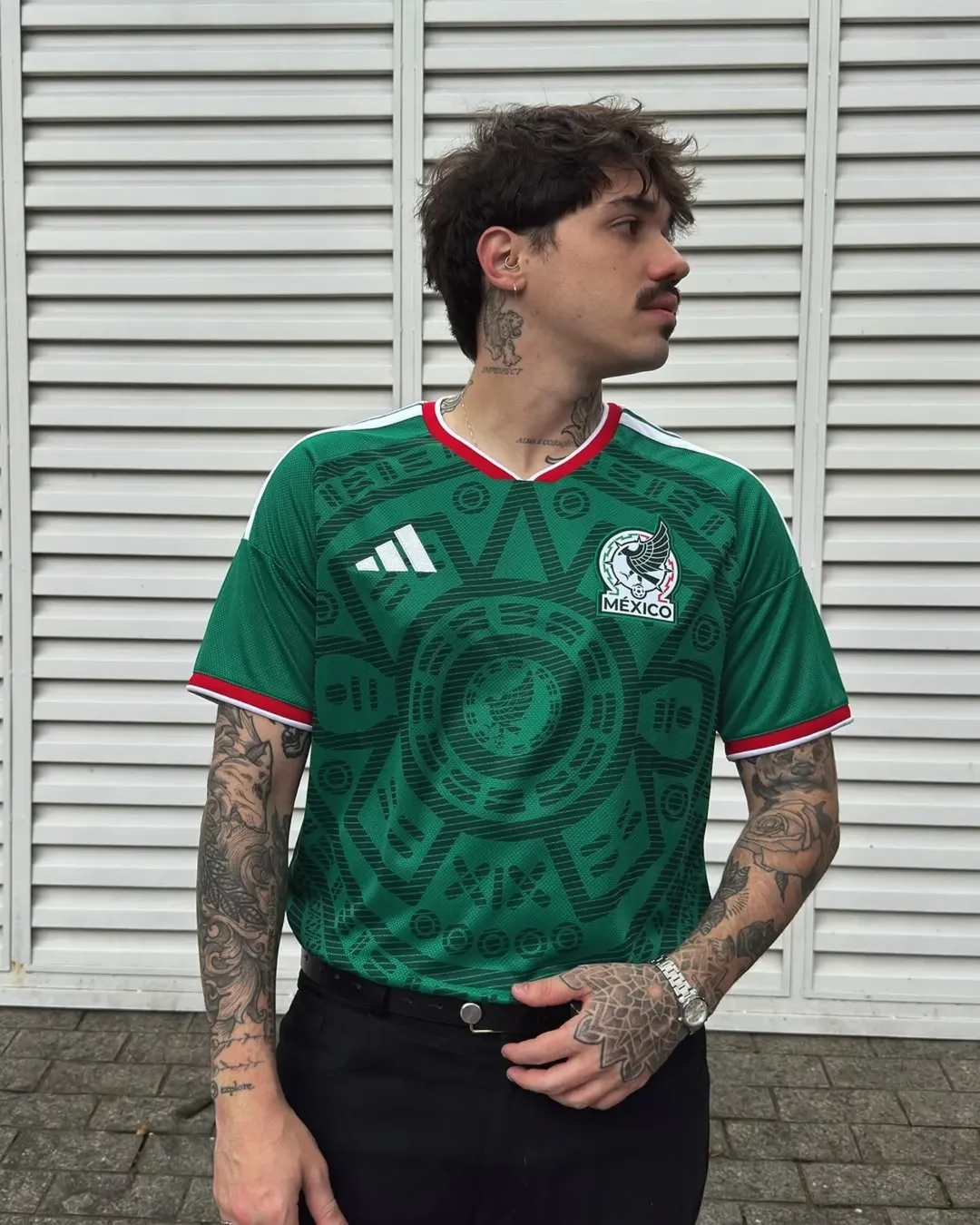 11. Mexico Green Jersey Tucked Into Black Slim Trousers