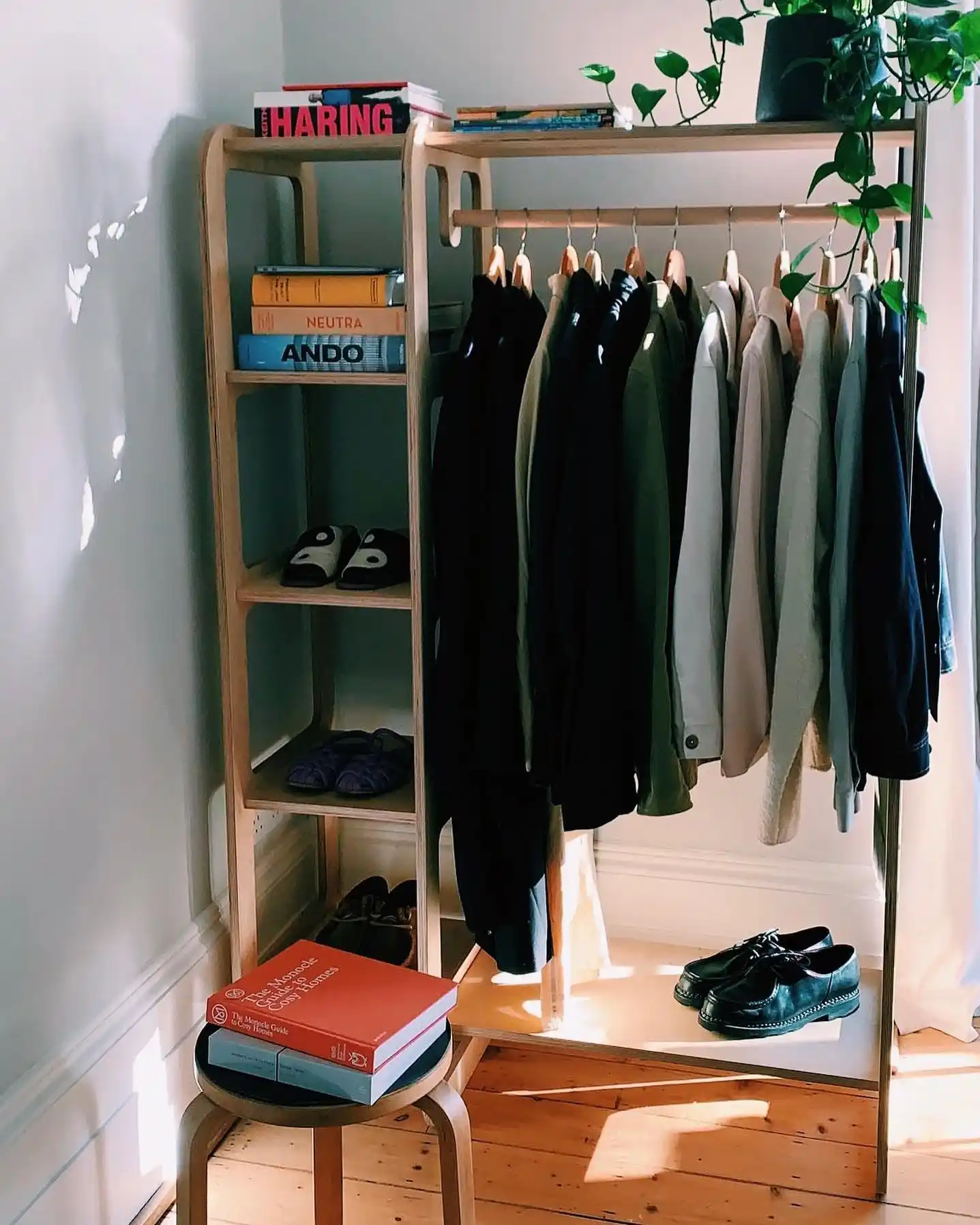 13 Minimalist Men’s Wardrobe Layouts for Small Closets 4 3. Freestanding Wooden Garment Rack