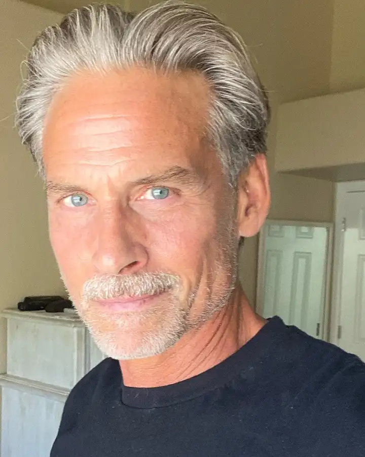 Grey Hair Styles for Men Over 50: 18 Looks That Command Respect 6 Swept Back and Full on Top, With a Mustache to Match