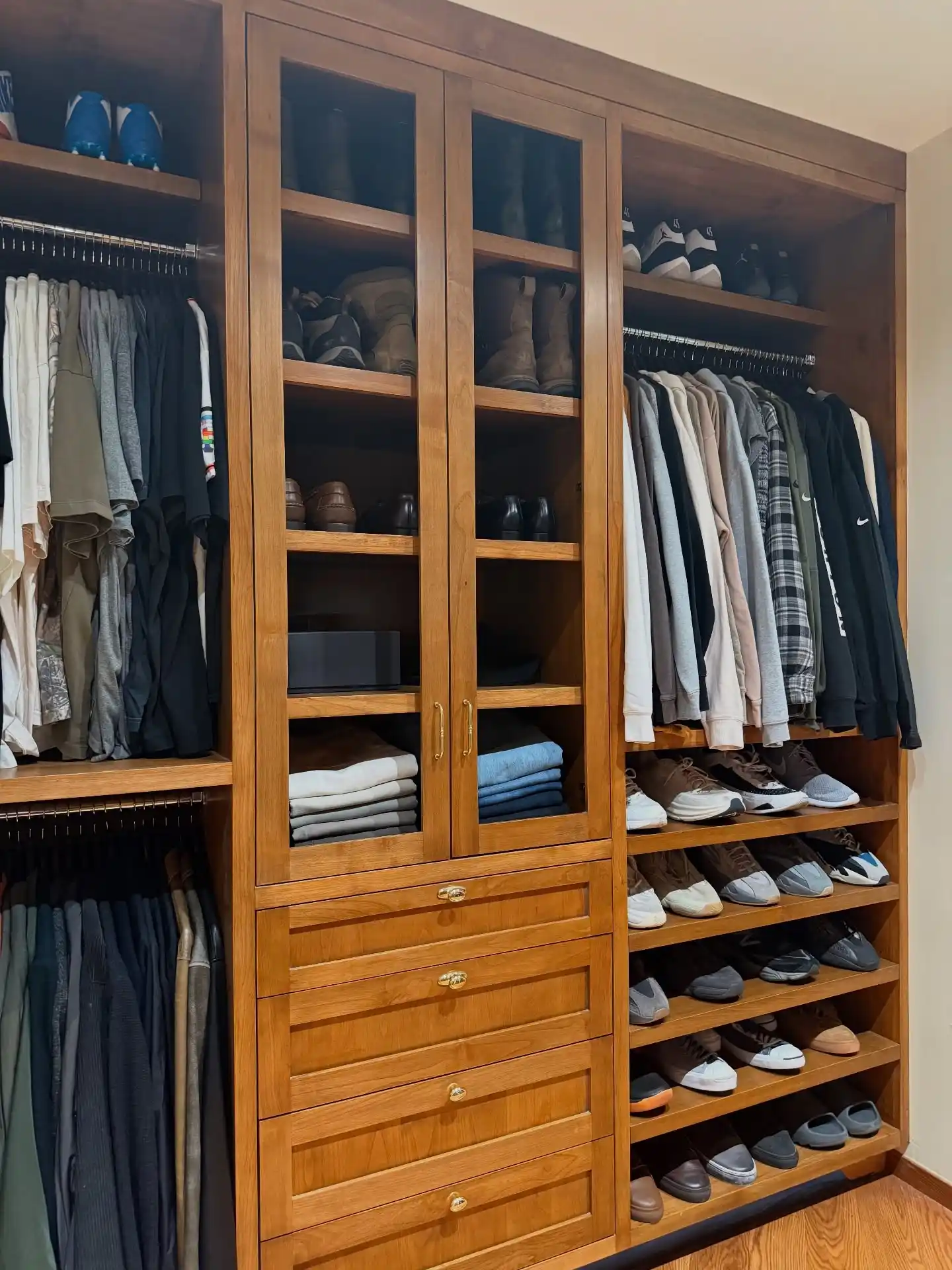 13 Minimalist Men’s Wardrobe Layouts for Small Closets 13 12. Glass Door Wooden Cabinetry Unit