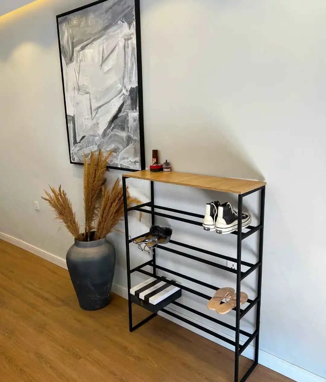 13 Minimalist Men’s Wardrobe Layouts for Small Closets 11 10. Minimalist Tiered Shoe Console
