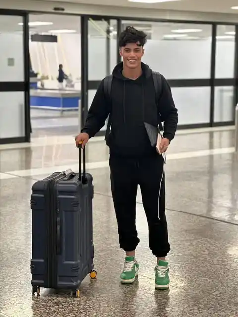 11. The Cozy Black Hoodie and Vibrant Sneakers