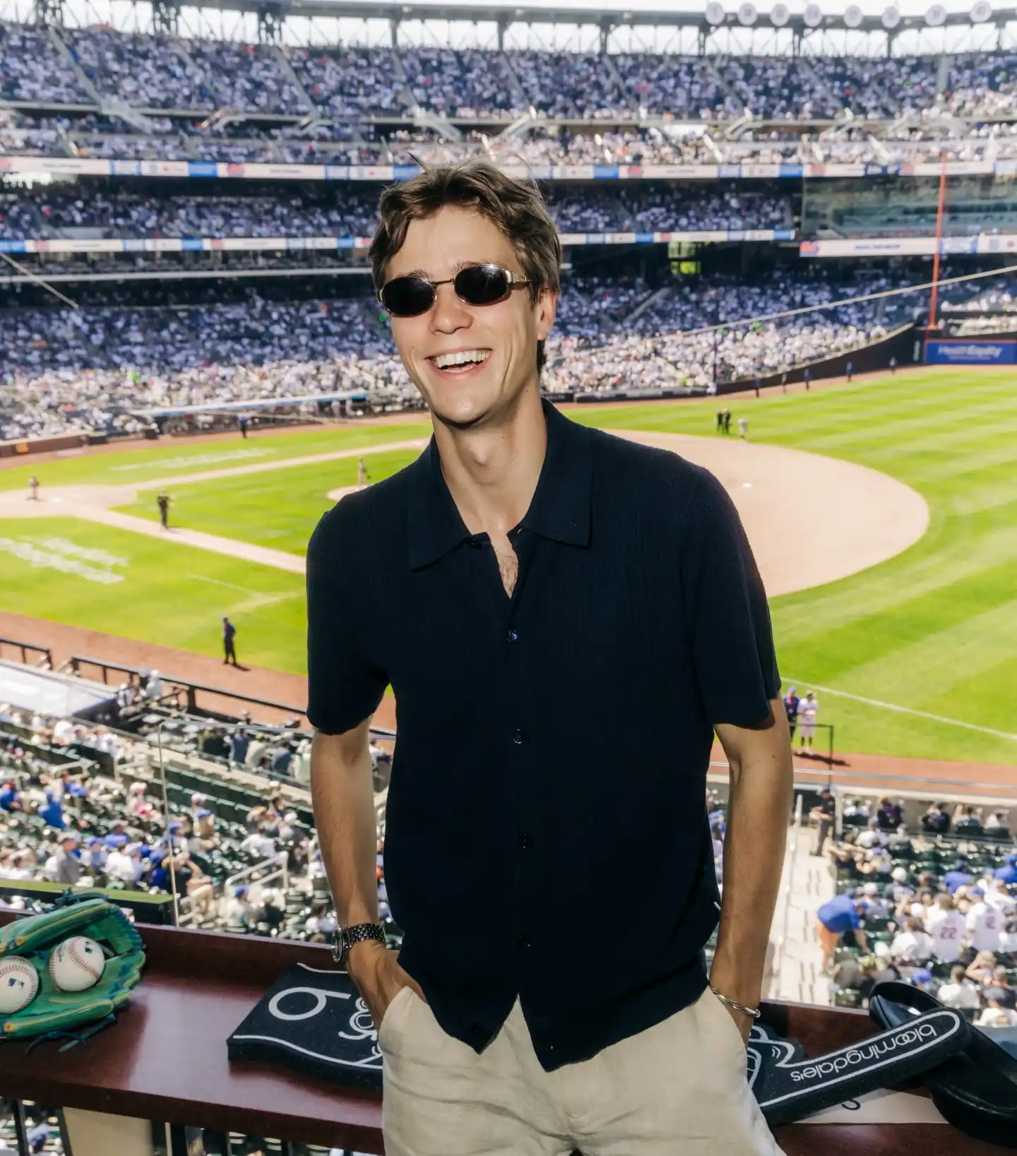 2. Navy Button-Up Jersey With Khaki Shorts and Oval Sunglasses