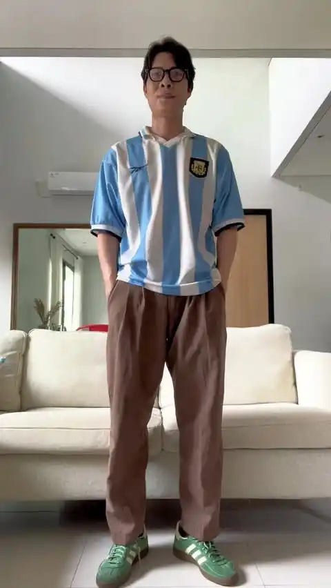 9. The Light Blue Striped Kit and Pleated Khakis