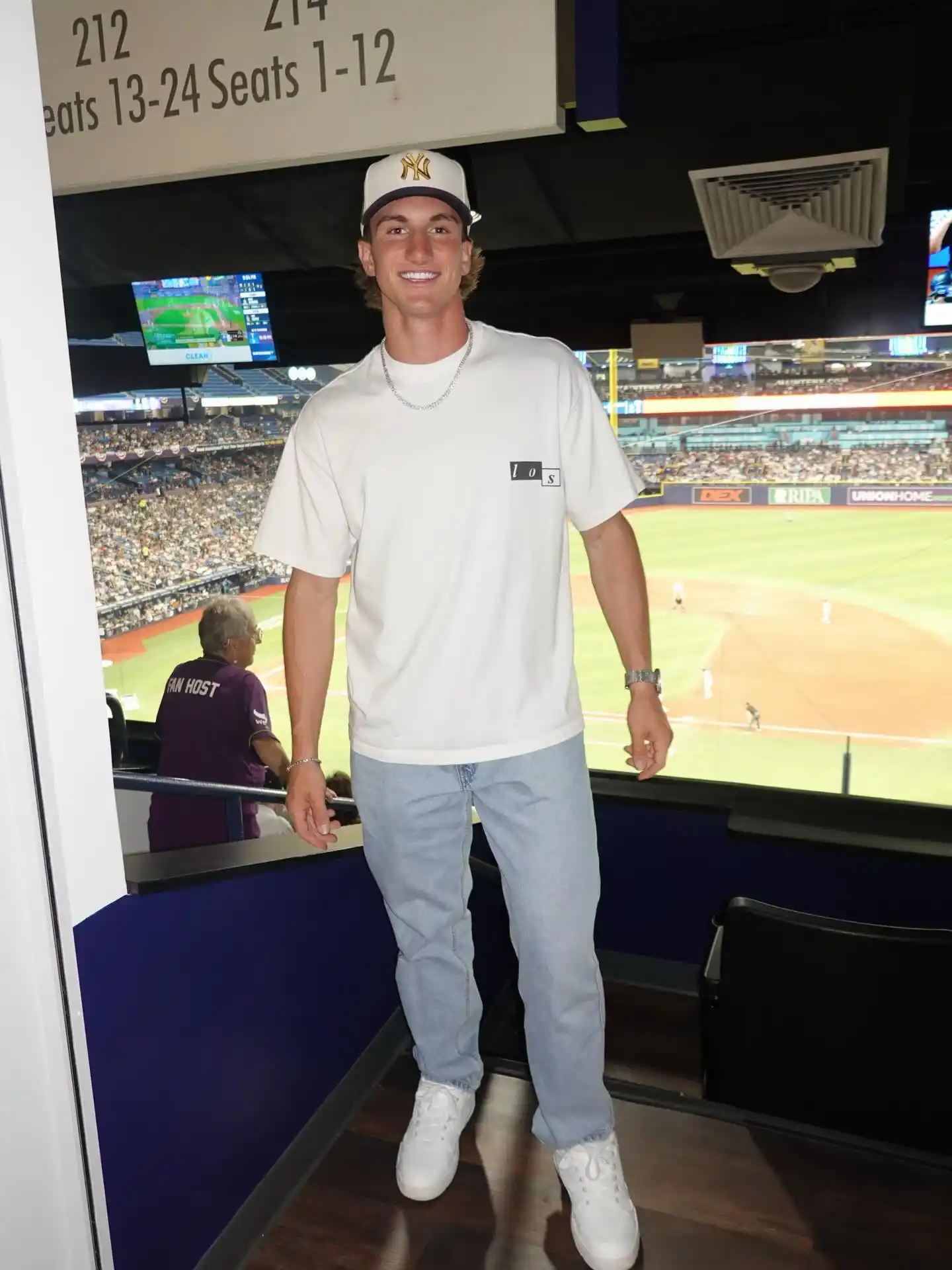 5. White Graphic Jersey Tee With Light Wash Jeans and White Sneakers