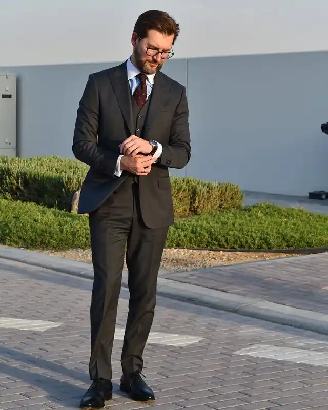 7. The Three Piece Charcoal Suit with Cuffed Trousers