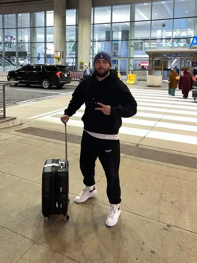 11 Airport Outfit Men Tall Guys Swear By 5 4. The Monochrome Sweatsuit and Beanie Setup