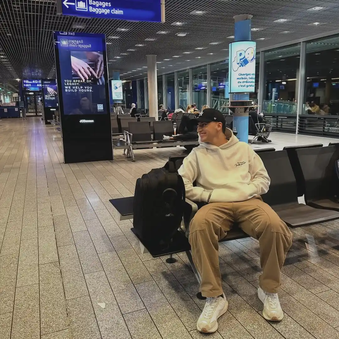 11 Airport Outfit Men Tall Guys Swear By 4 3. The Classic Hoodie and Khaki Cargo Look