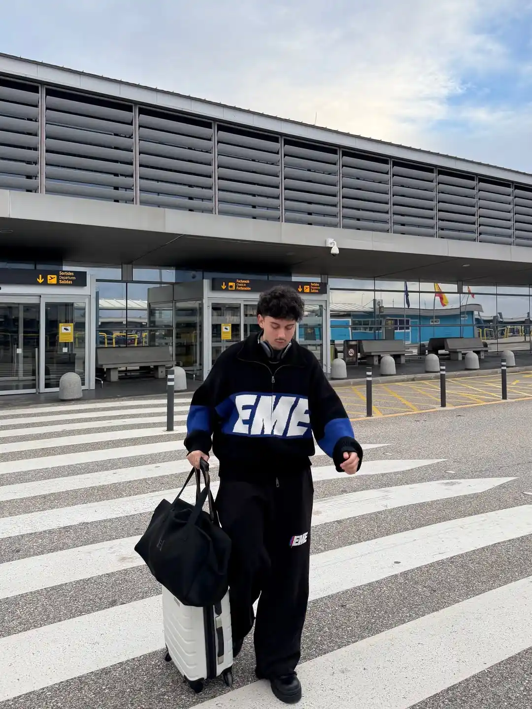 11 Airport Outfit Men Tall Guys Swear By 10 9. The Graphic Quarter Zip and Relaxed Trousers Combo