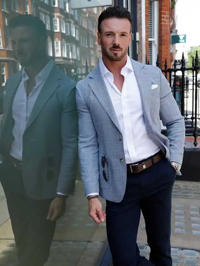 16 Stylish Airport Outfits for Men on Business Trips 14 Sunglasses Tucked in the Pocket, the Small Detail That Finishes a Grey Blazer