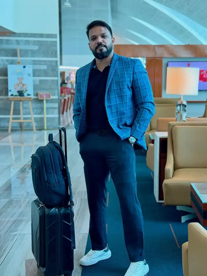 16 Stylish Airport Outfits for Men on Business Trips 13 Windowpane Plaid and a Polo for Business Casual That Skips the Dress Shirt Entirely