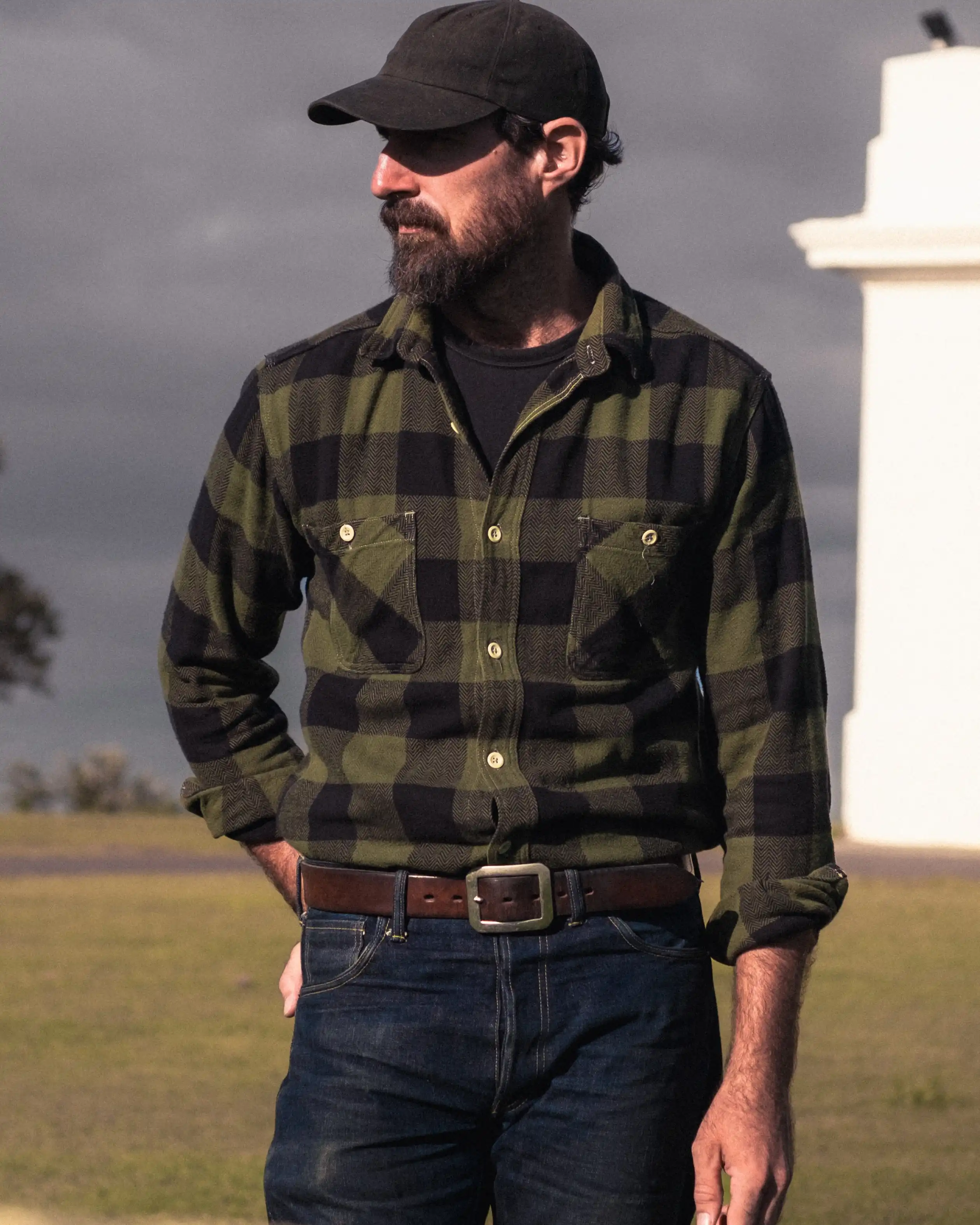 4. Quilted Vest With Flannel Shirt and Dark Jeans