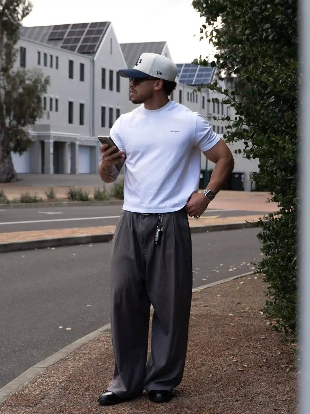15 Classy Streetwear Outfit Ideas for Men That Elevate the Game 9 7. Relaxed White Tee and Oversized Grey Trousers