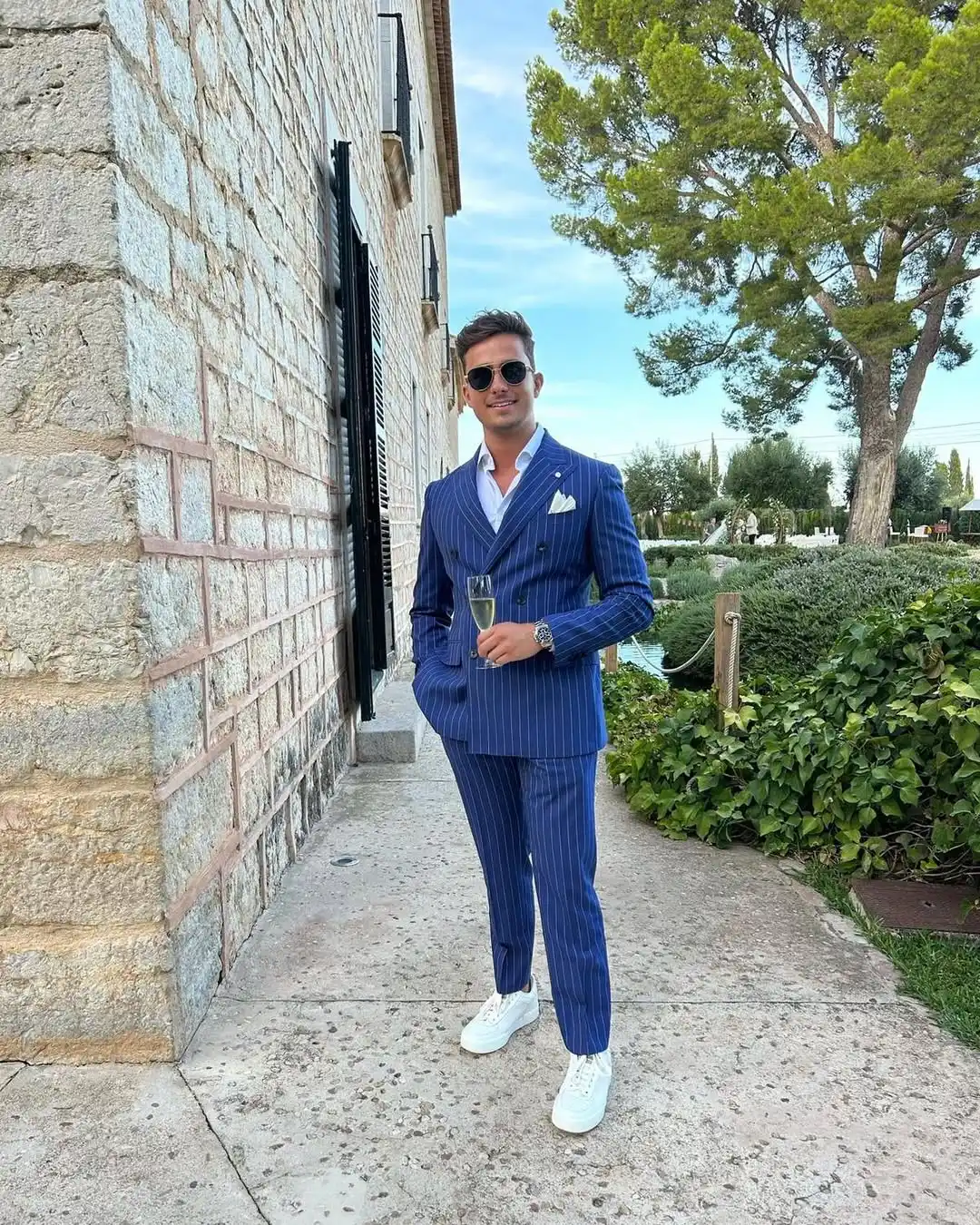 4. Navy Pinstripe Suit With White Sneakers
