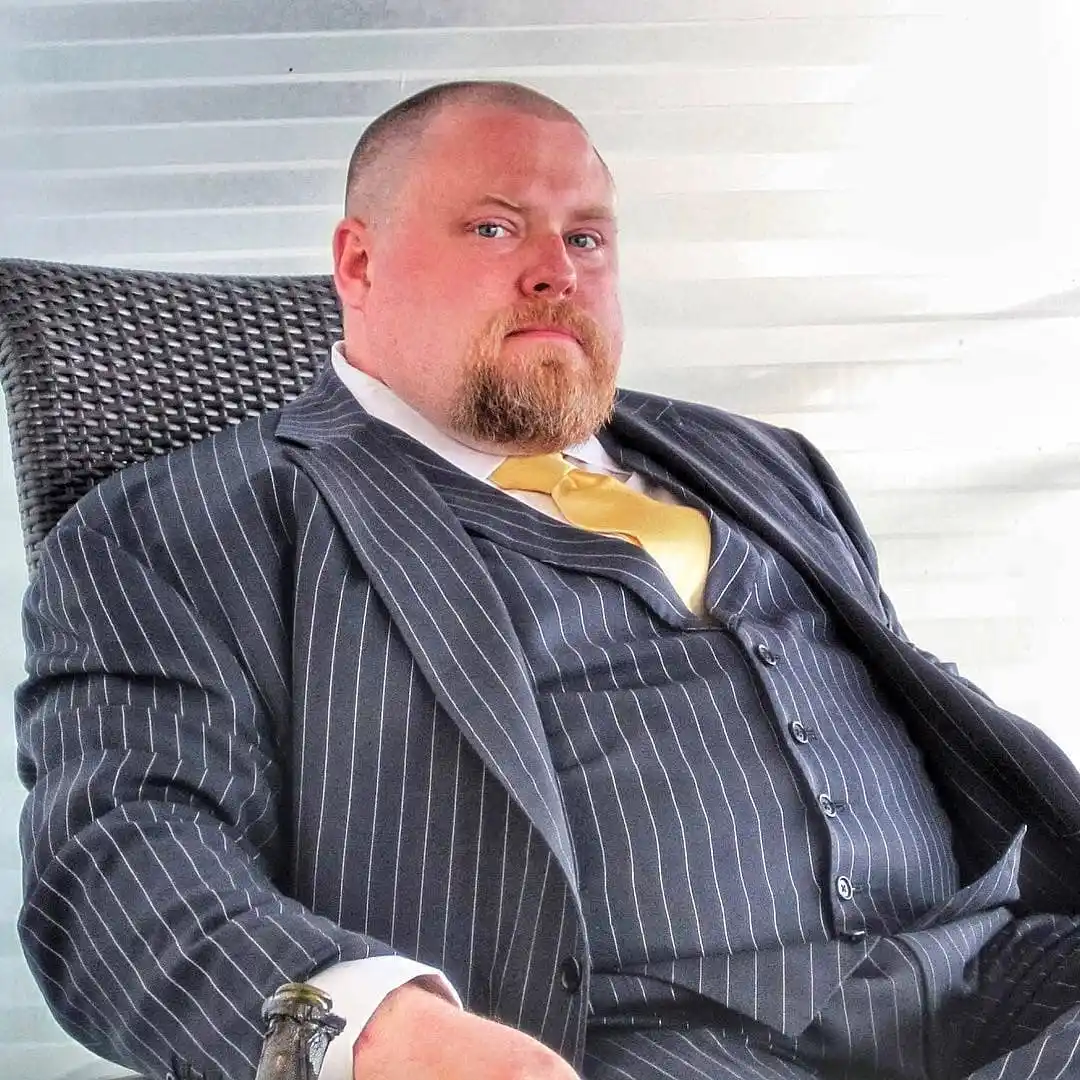 Wedding Guest Outfit for Plus Size Men: 15 Stylish Ideas 5 1. Charcoal Pinstripe Three Piece Suit