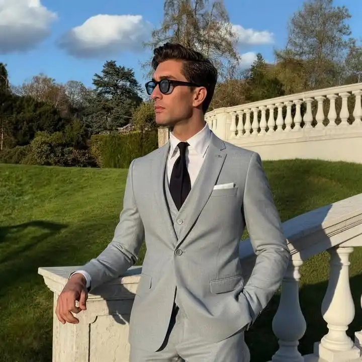 15 Winter Wedding Guest Outfit Ideas for Men 12 10. Light Grey Three Piece Suit with Black Tie
