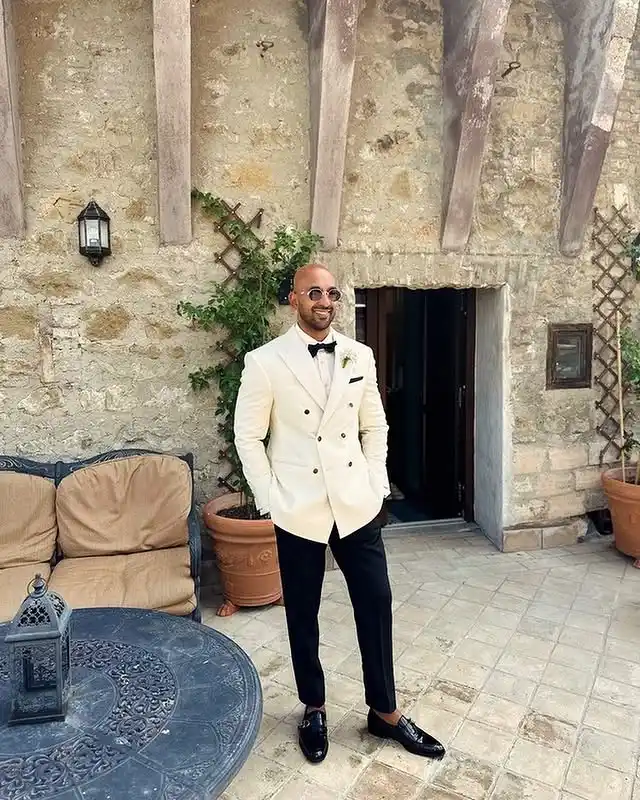 12. The Double-Breasted Cream Jacket and Black Trousers
