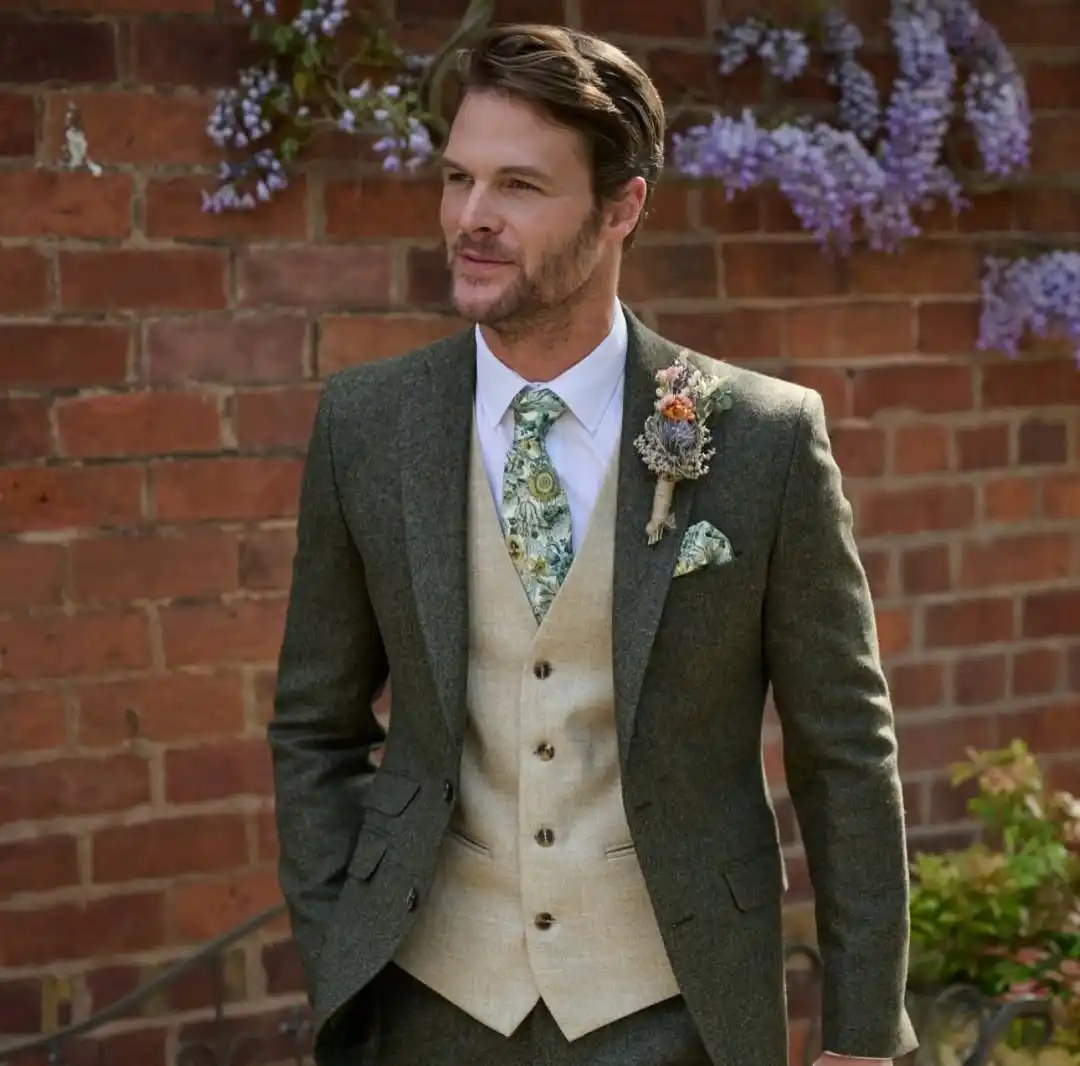 15 Winter Wedding Guest Outfit Ideas for Men 6 4. Green Tweed Suit with Floral Waistcoat