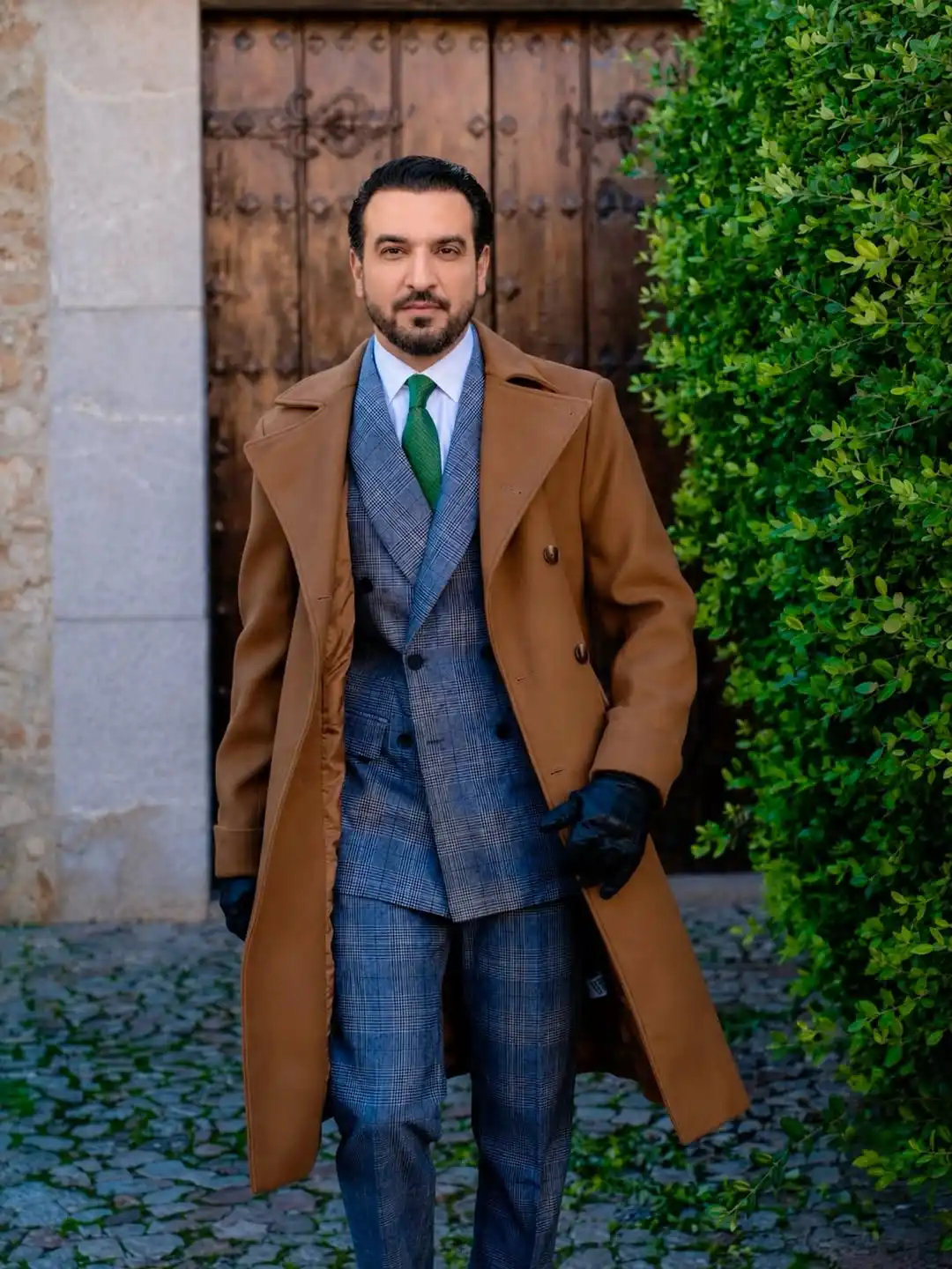 15 Winter Wedding Guest Outfit Ideas for Men 11 9. Camel Overcoat with Blue Plaid Suit