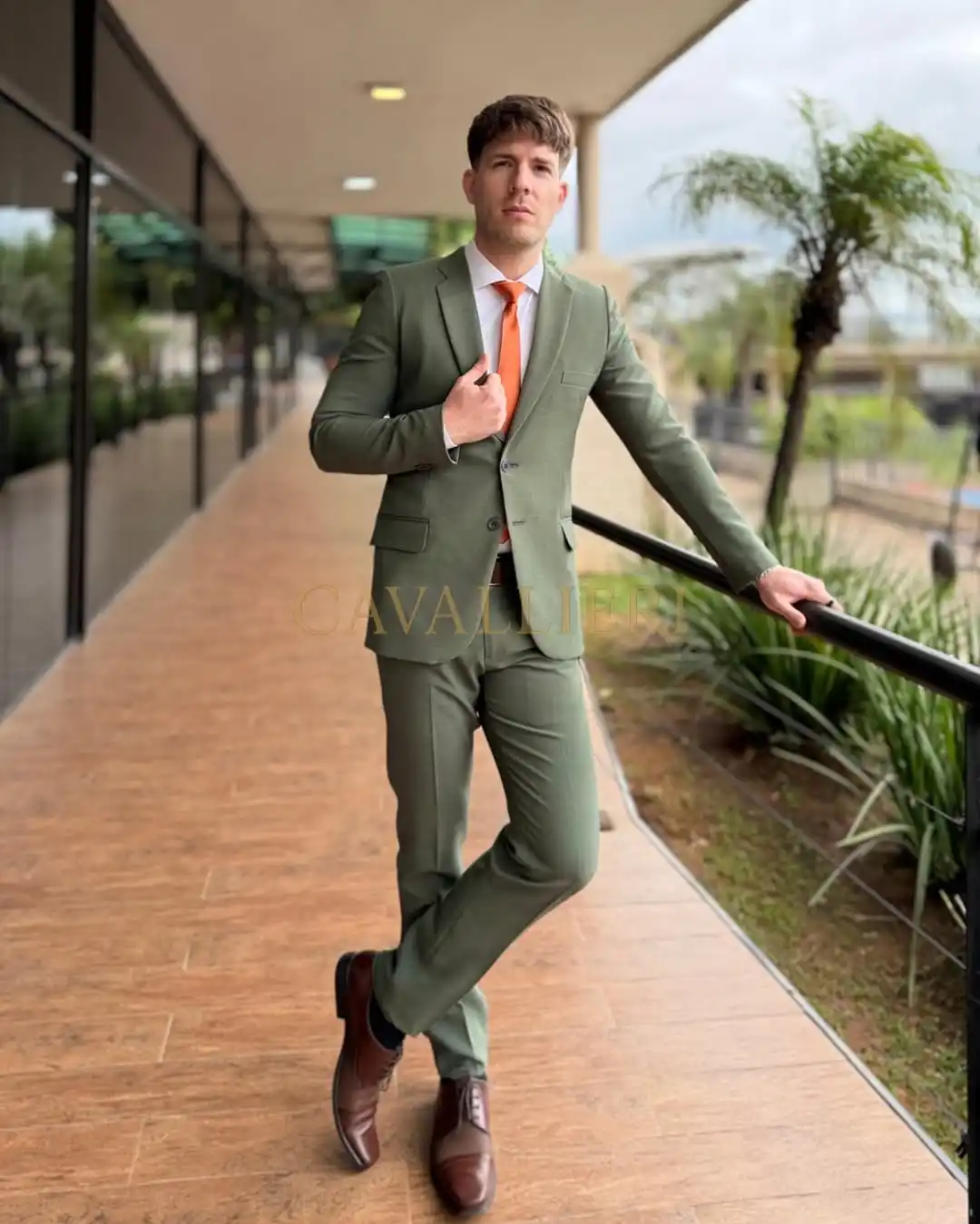3. Sage Green Suit with Orange Tie