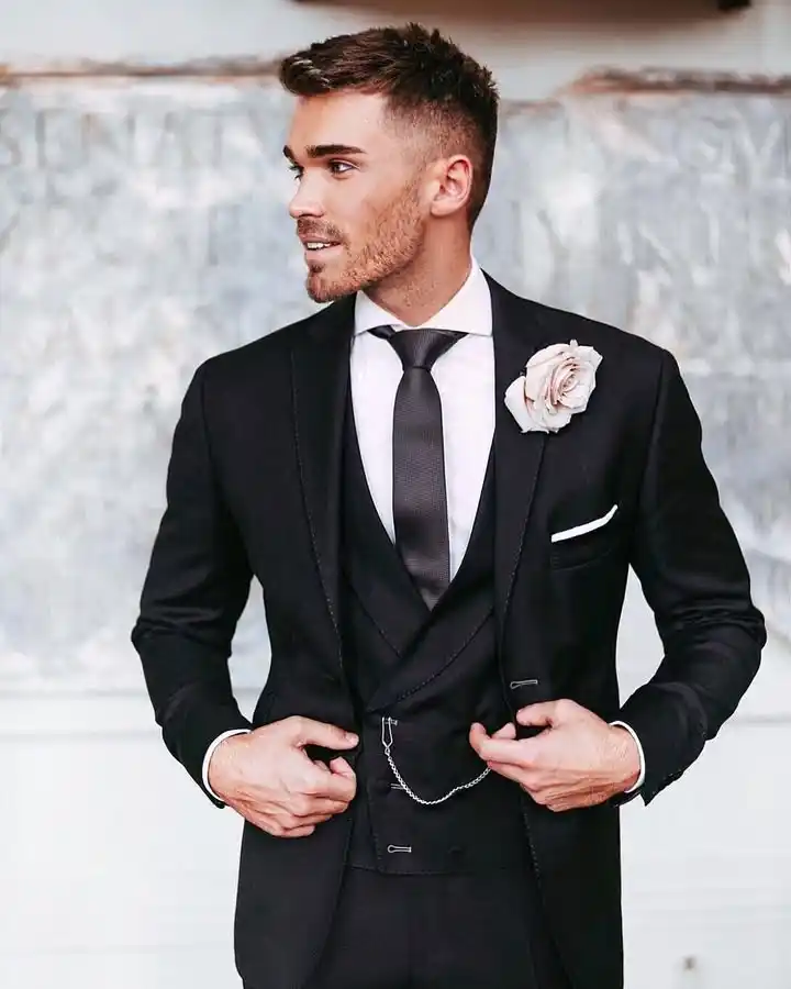 6. Black Three Piece Suit with Boutonniere
