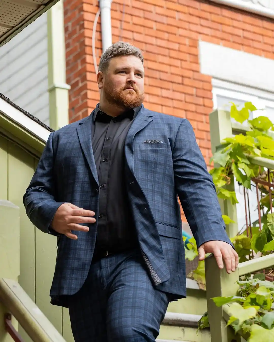 Wedding Guest Outfit for Plus Size Men: 15 Stylish Ideas 9 4. Navy Plaid Blazer with Black Shirt
