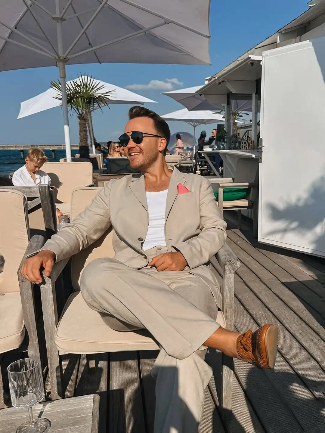 6. Beige Suit with White Tank Top