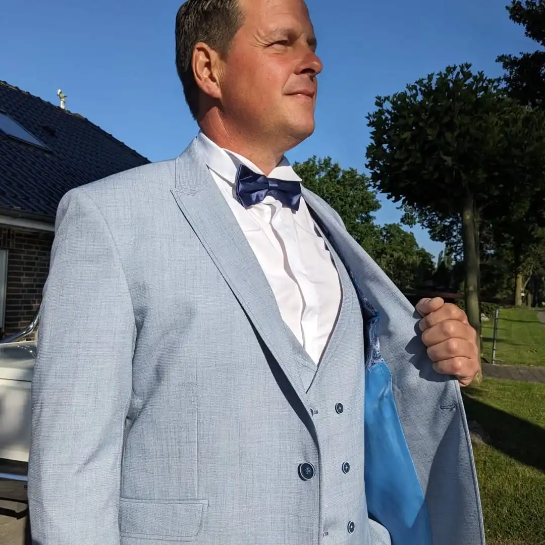 8. Light Gray Three Piece Suit With Bow Tie