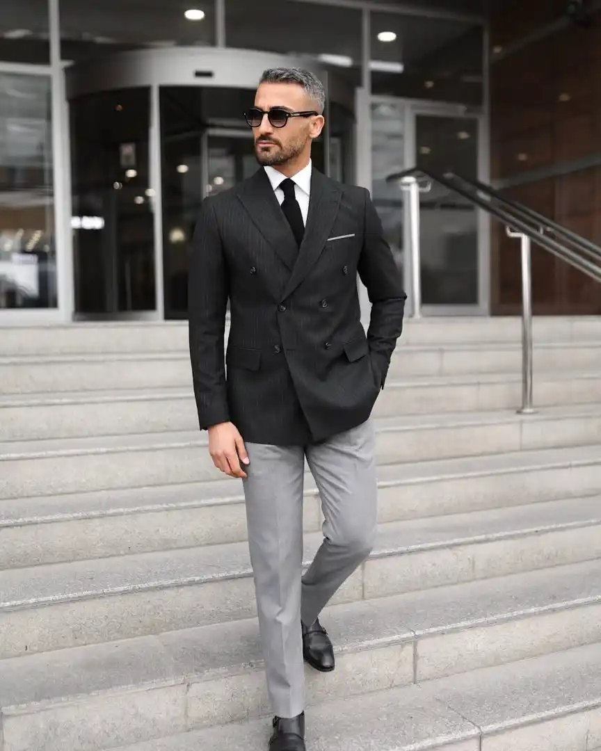 11. Black Blazer with Grey Trousers